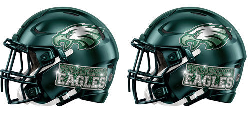 Twin midnight green football helmets with silver accents and a eagle wing graphic UV DTF transfer for a 16oz glass can